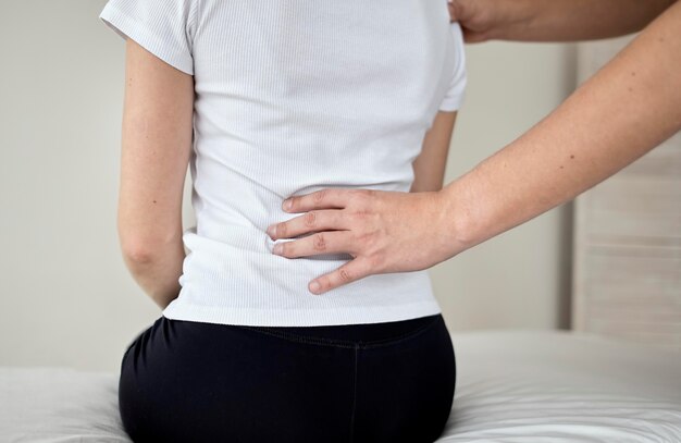 Therapist undergoing physical therapy with female patient