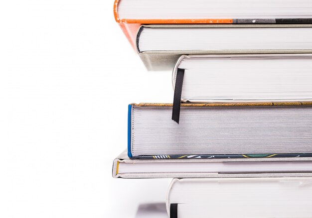 Thick books isolated on a white surface