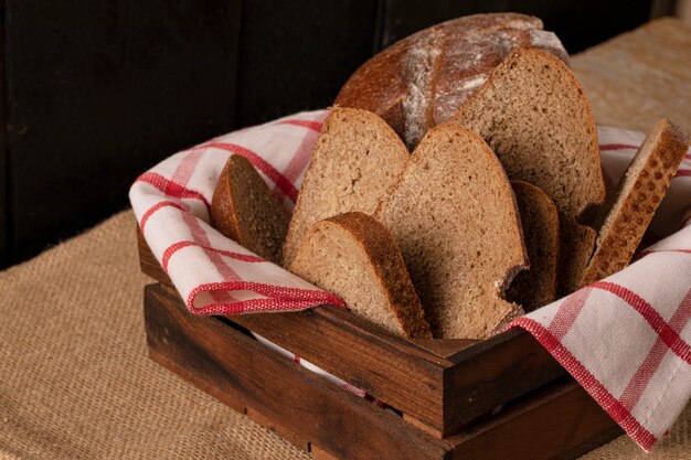 Thin bread slices in a wooden basket.