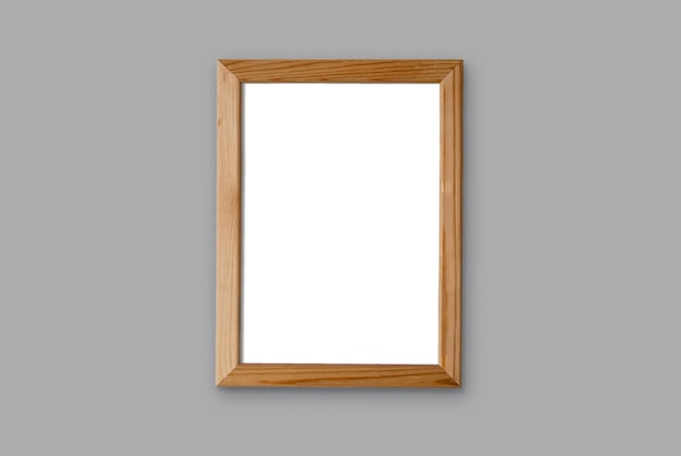 Free photo thin wooden frame over grey wall