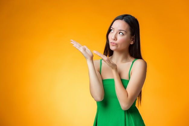 thinking Chinese girl on yellow