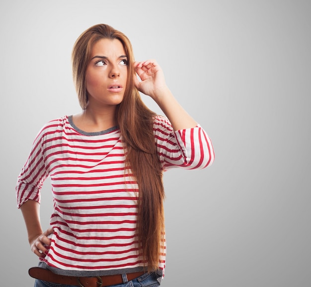 Free photo thinking female on a gray background