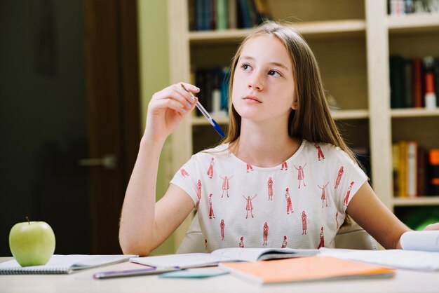 Thinking girl at desk