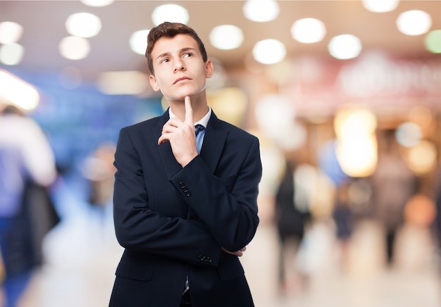 Free photo thinking man with suit