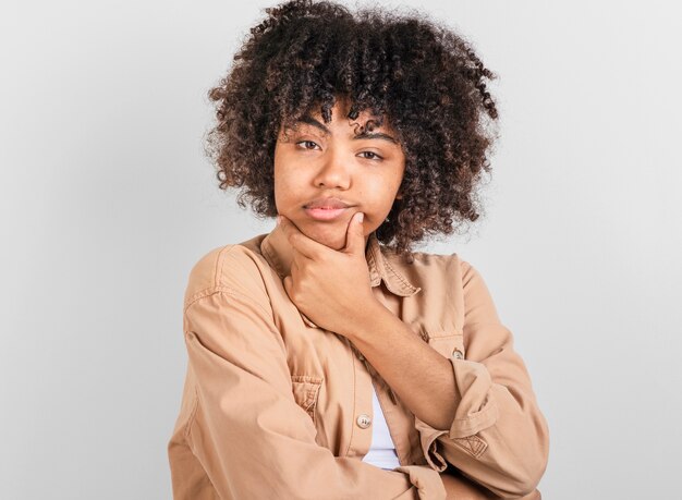 Thinking woman looking at photographer