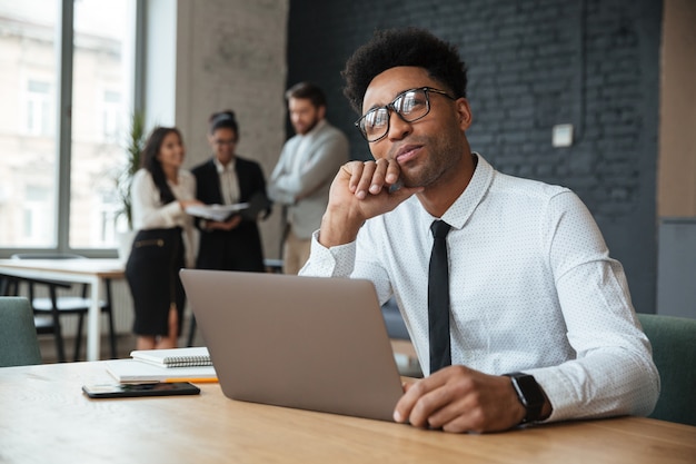 Thinking young african businessman