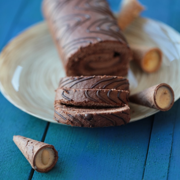 Free photo thinly sliced swiss chocolate roll cake.