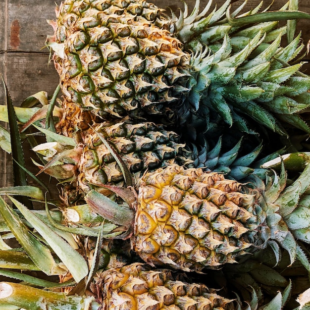 Thorny pineapples closeup in the market