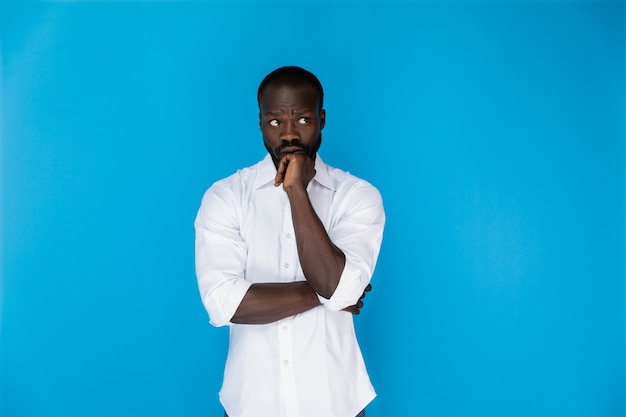 Thoughtful afro-american in white shirt