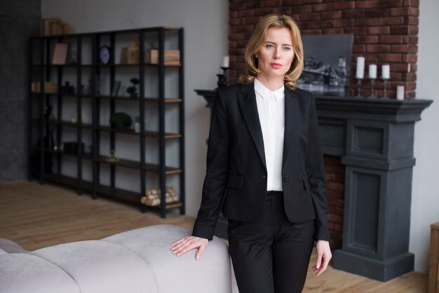 Thoughtful business woman in black suit