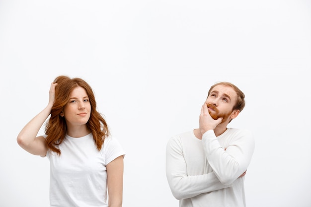 Free photo thoughtful confused redhead couple