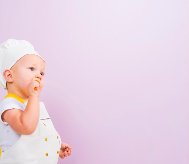 Free photo thoughtful cook child looking away