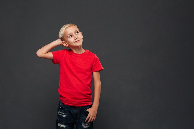 Thoughtful cute little boy child