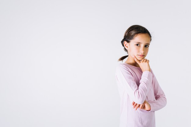 Thoughtful girl looking at camera