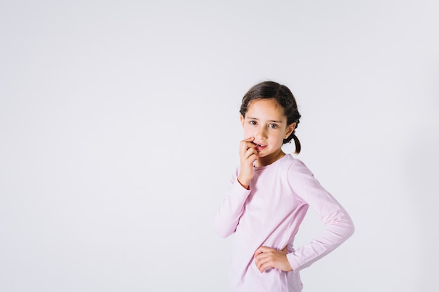 Thoughtful girl looking at camera