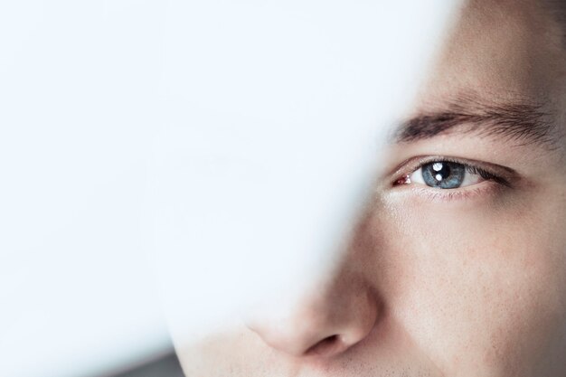 Thoughtful man looking through glass background business vision