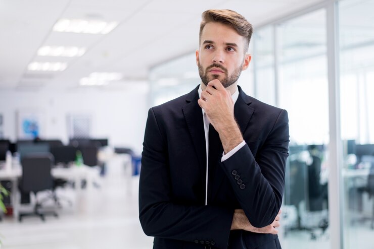 Free Photo thoughtful man in suit
