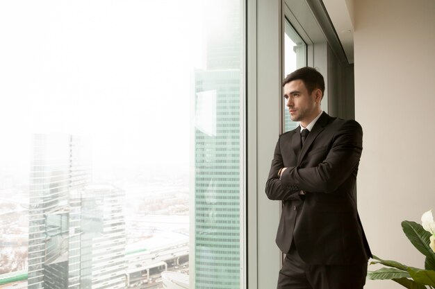 Thoughtful millennial CEO dreaming of success