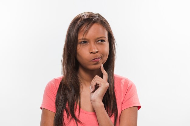 Thoughtful pretty african girl on white background