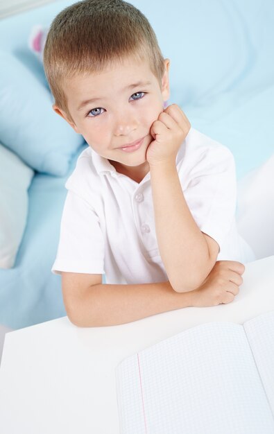 Thoughtful pupil with white t-shirt