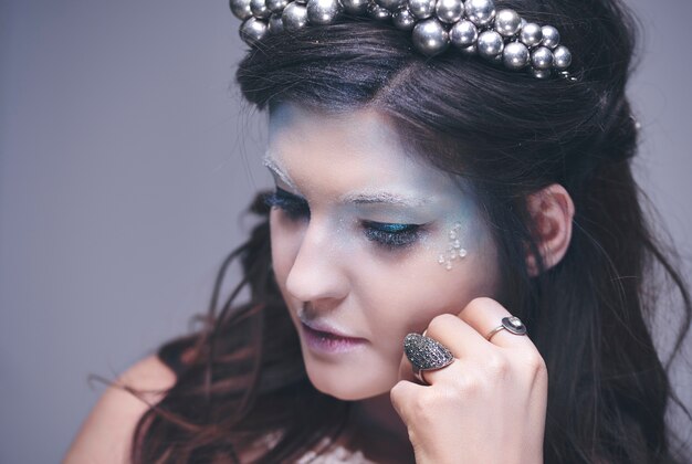 Thoughtful and sad ice maiden at studio shot