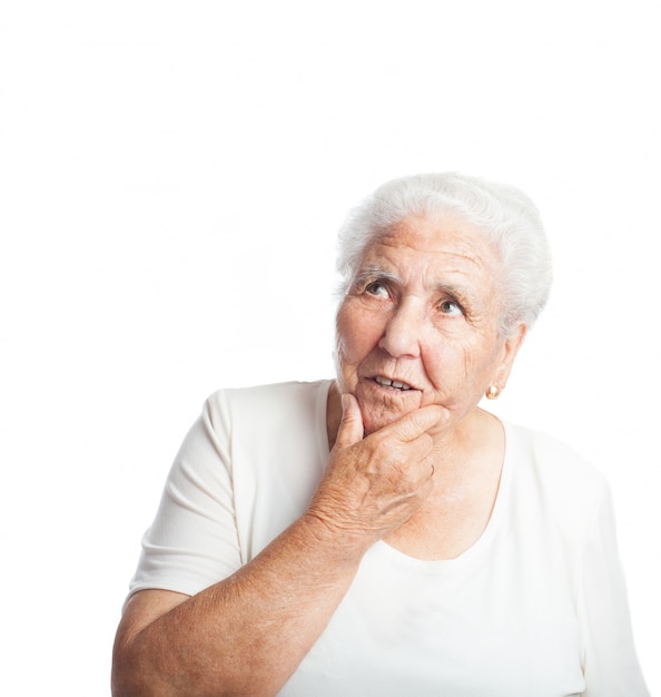 Thoughtful senior woman with hand on face