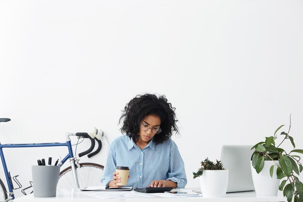 Thoughtful serious professional worker female sitting in office