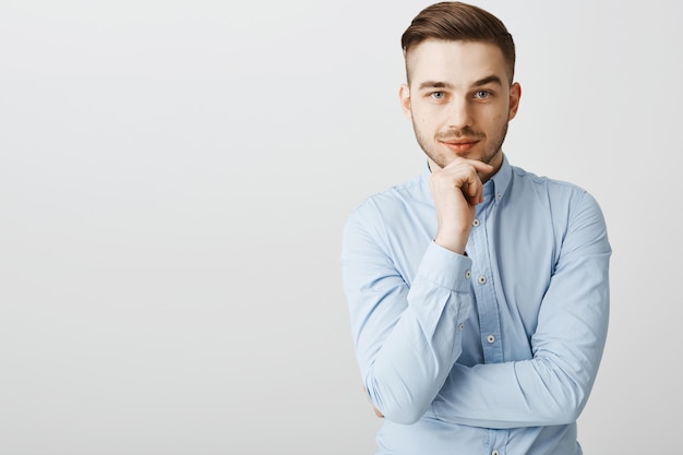 Thoughtful smart businessman thinking and looking, pondering new ideas