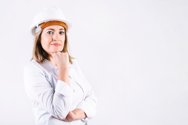 Thoughtful woman in helmet