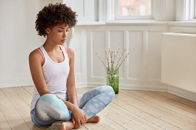 thoughtful woman posing in her home