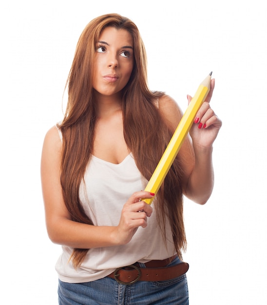 Thoughtful woman with pencil