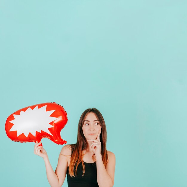 Thoughtful woman with speech balloon