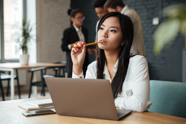 Thoughtful young asian businesswoman