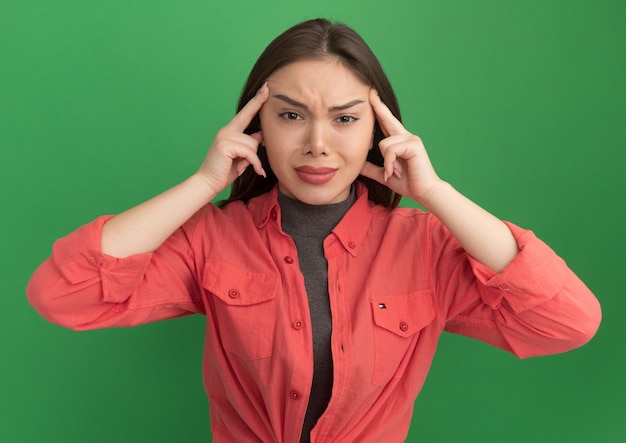 Thoughtful young pretty woman doing think gesture 