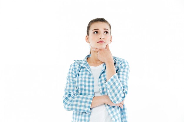 Thoughtful young woman looking aside