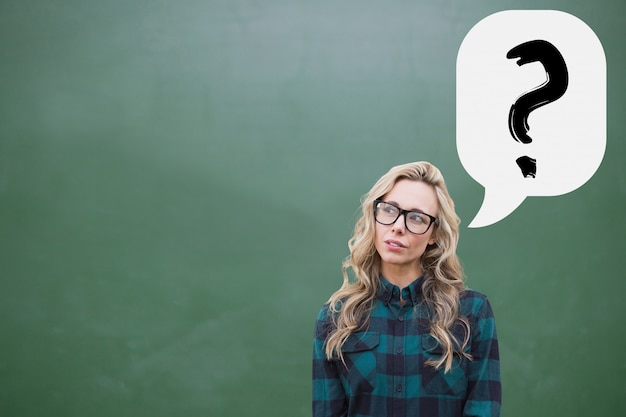 Thoughtful young woman with a question mark