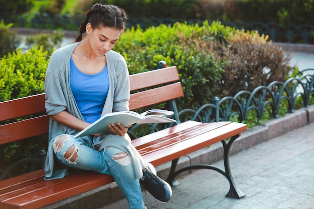 Thouhtful beautiful african girl reading the book