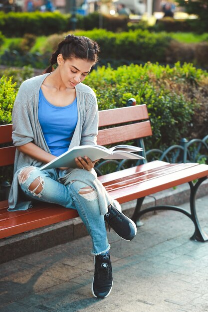 Thouhtful beautiful african girl reading the book