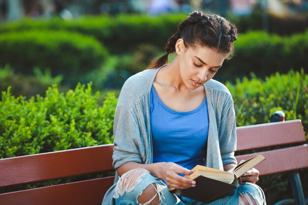 Thouhtful beautiful african girl reading the book