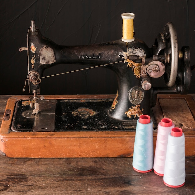 Threads near antique sewing machine