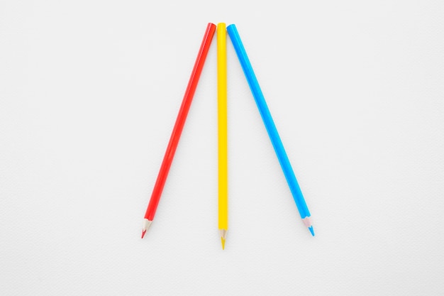 Free photo three bright pencils on white