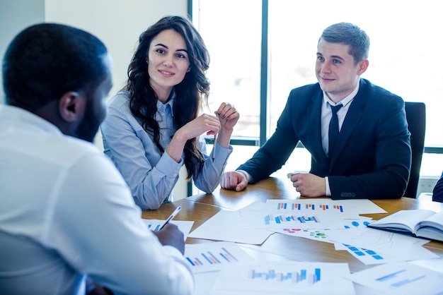 Three business people in a meeting