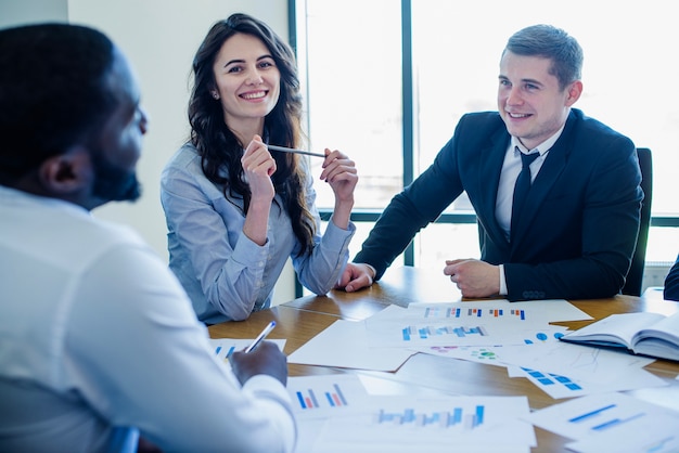 Three businesspersons in a meeting