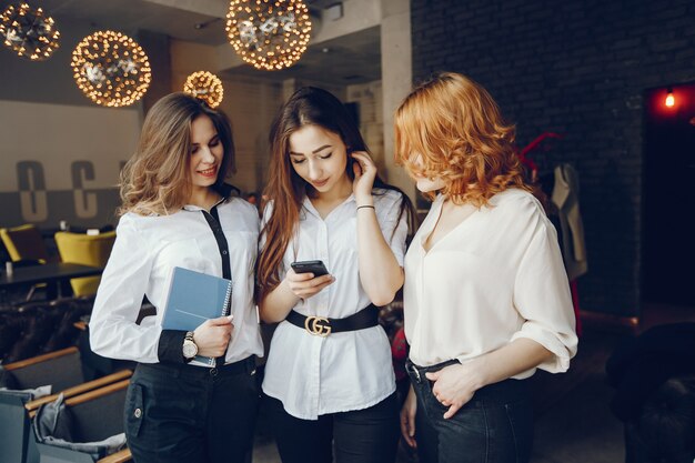 three businesswomen in a cafe