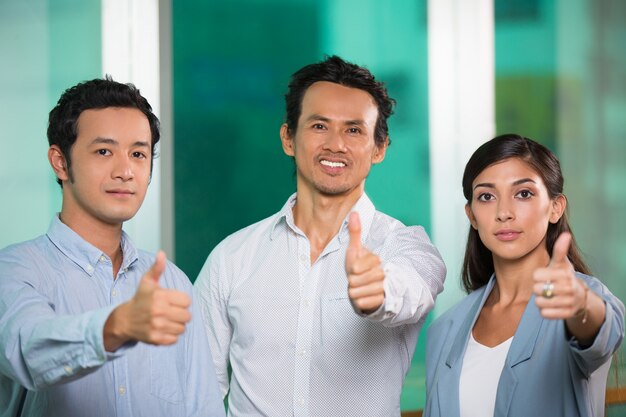 Three Content Business People Showing Thumbs up