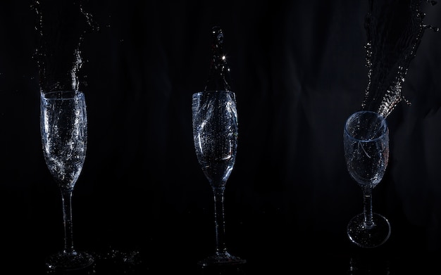 Three crystal glasses with water