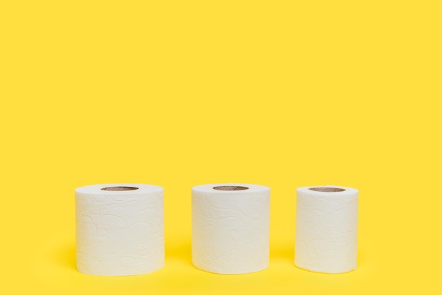 Three different sized toilet paper rolls