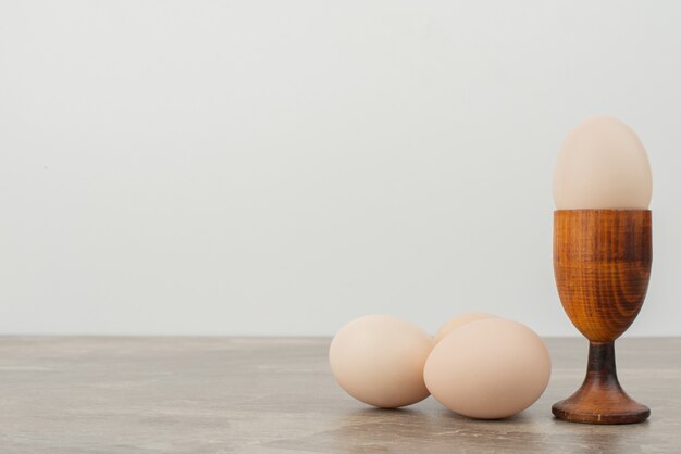 Three eggs on white surface 