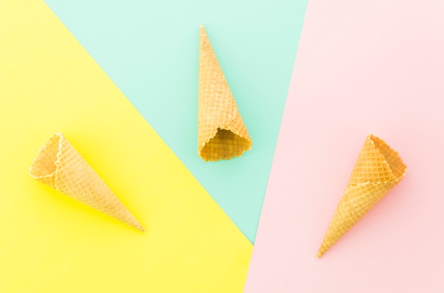 Three empty waffle cones on table