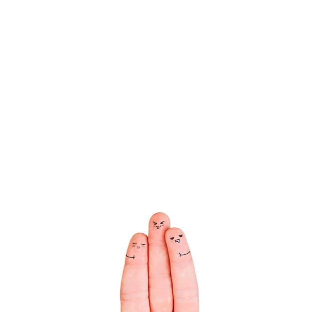 Three fingers with faces on white